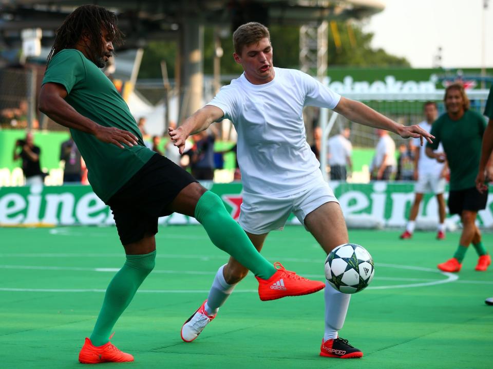 Max Verstappen (right) competes in a charity soccer game.