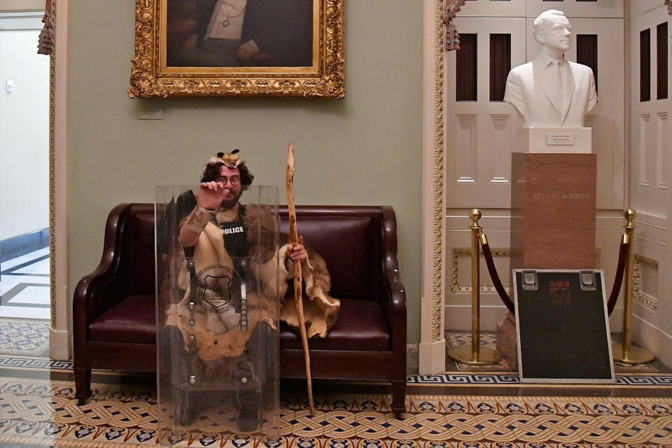 Aaron Mostofsky, son of Kings County Supreme Court Judge Shlomo Mostofsky, sits with a police vest and riot shield after supporters of President Donald Trump occupied the U.S. Capitol in Washington, U.S., January 6, 2021. Picture taken January 6, 2021.    REUTERS/Mike Theiler