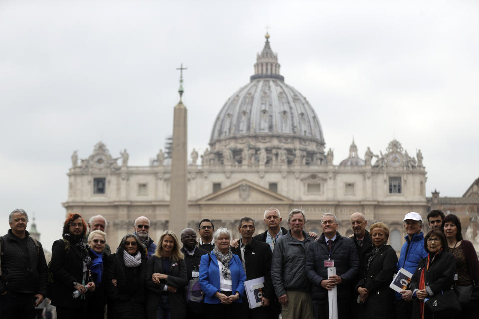 Members of the ECA (Ending of Clergy Abuse) organization and survivors of clergy sex abuse pose for photographers outside St. Peter's Square, at he Vatican, Monday, Feb. 18, 2019. Organizers of Pope Francis' summit on preventing clergy sex abuse will meet this week with a dozen survivor-activists who have come to Rome to protest the Catholic Church's response to date and demand an end to decades of cover-up by church leaders. (AP Photo/Gregorio Borgia)