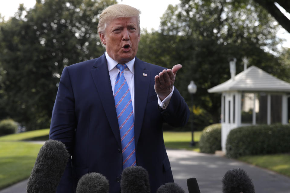 President Donald Trump speaks to reporters before departing the White House in Washington, Friday, Aug. 2, 2019, for the short trip to Andrews Air Force Base and onto his Bedminster, N.J., golf club. (AP Photo/Carolyn Kaster)