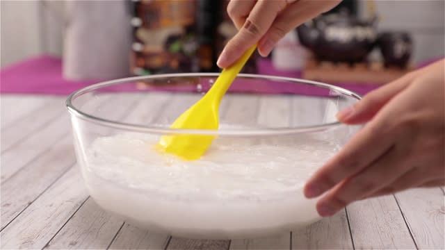 Mixing rice flour mixture with a spatula