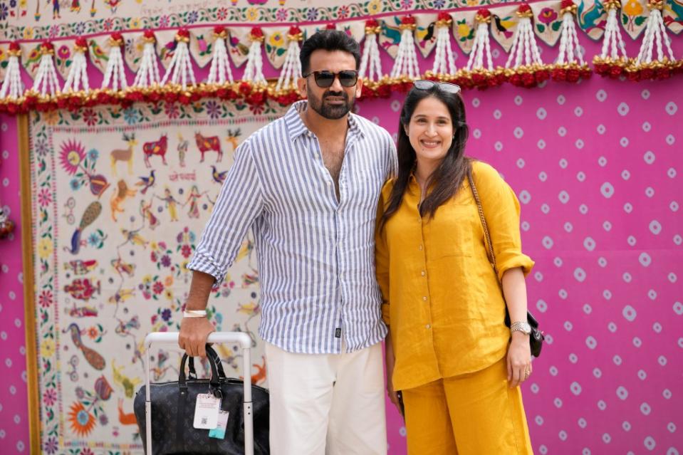 Famous sports players like former Indian cricketer Zaheer Khan, left, and his wife Sagarika Ghatge were in attendance for the wedding celebrations. AP