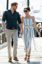 <p> Meghan stepped out with Prince Harry for a walk around Fraser Island. The Duchess of Sussex wore a striped&#xA0;Reformation dress&#xA0;with her brown&#xA0;Sarah Flint sandals. </p>