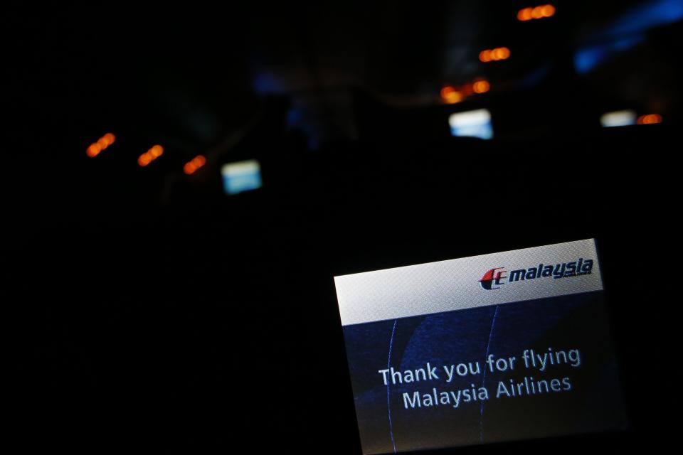 A screen on board Malaysia Airlines Boeing 777-200ER flight MH318 shows a welcome message shortly after take off on route to Beijing