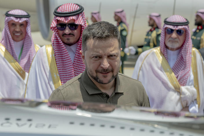 In this photo provided by Saudi Press Agency, SPA, Ukraine's President Volodymyr Zelenskyy arrives at Jeddah airport, Saudi Arabia, Friday, May 19, 2023. Zelenskyy arrived in Saudi Arabia ahead of an Arab summit on Friday, where he was set to address leaders who have remained largely neutral on Russia's invasion of his country, including many who maintain warm ties with Moscow. (Saudi Press Agency via AP)