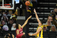 Iowa center Luka Garza shoots over Indiana forward Trayce Jackson-Davis, left, during the first half of an NCAA college basketball game, Thursday, Jan. 21, 2021, in Iowa City, Iowa. (AP Photo/Charlie Neibergall)