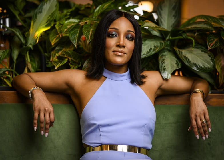 Mickey Guyton poses for a portrait at the at the Stateside Kitchen at Dream Nashville.