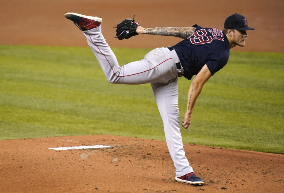 Boston Red Sox starting pitcher Tanner Houck follows through on a delivery during the first inning of a baseball game against the Miami Marlins, Tuesday, Sept. 15, 2020, in Miami. (AP Photo/Lynne Sladky)