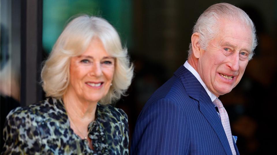 A close-up of Queen Camilla and King Charles smiling during an outing