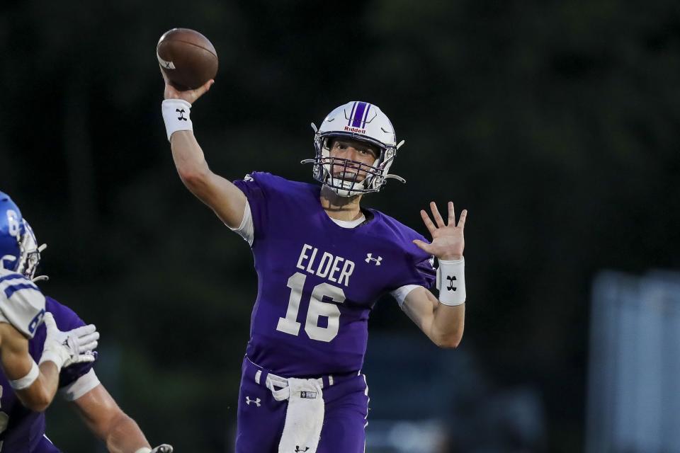 Elder quarterback Ben Schoster (16) throws a pass against Covington Catholic in the second half at Covington Catholic High School Aug. 19, 2022.
