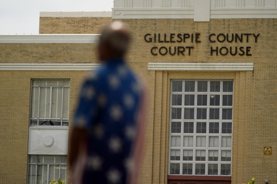 Mo Saiidi, chairmen of the Gillespie County GOP, speaks outside the County court house Wednesday, Aug. 17, 2022, in Fredericksburg, Texas. On the brink of November's midterm elections, both full-time election workers in rural Gillespie County suddenly and stunningly quit this month with less than 70 days before voters start casting ballots. (AP Photo/Eric Gay)