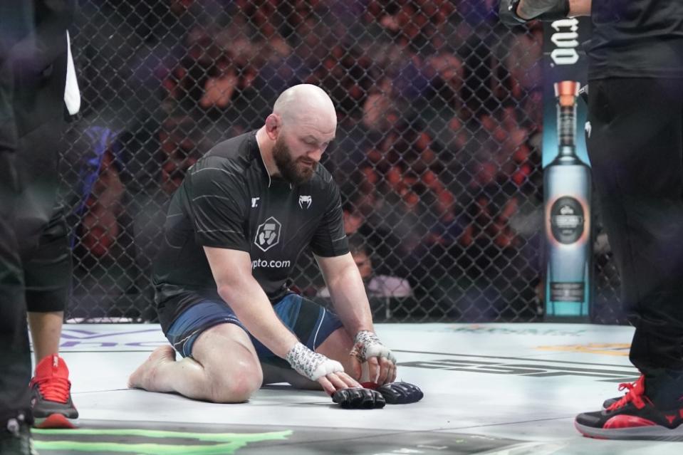 Apr 15, 2023; Kansas City, Missouri, USA; Zak Cummings (red gloves) reacts after the fight against Ed Herman (blue gloves) after their fight during UFC Fight Night at T-Mobile Center. Mandatory Credit: Denny Medley-USA TODAY Sports