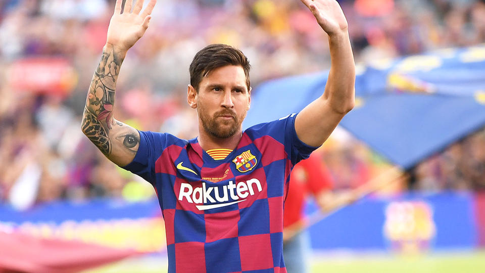 Messi is seen here saluting fans during a match for Barcelona. 