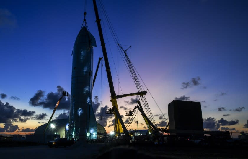 BROWNSVILLE, TX - SEPTEMBER 27: Workers put the finishing touches on a prototype of a spaceship called Starship before SpaceX CEO Elon Musk arrives to update the progress on the project. (Photo by Jonathan Newton / The Washington Post via Getty Images)