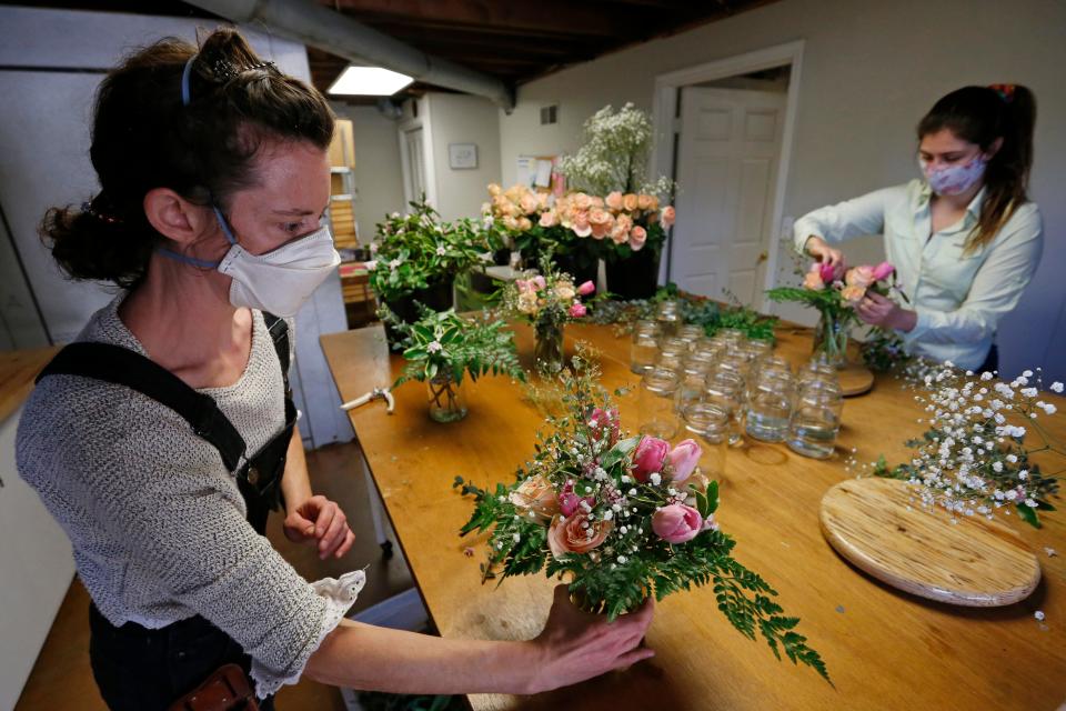 Farm owner Rita O'Brien and Sophie Greenberg make up flower arrangements for Valentines Day orders at R&R Secret Farm in Athens, Ga., on Friday, Feb. 11, 2022. ÒI just feel like we should offer something for Valentines Day and a big part of that is we want to keep our staff,Ó said O'Brien,Ó ÒTheres no money coming in between mid December until the farmers market starts back in march and itÕs really hard to keep a year round staff.Ó