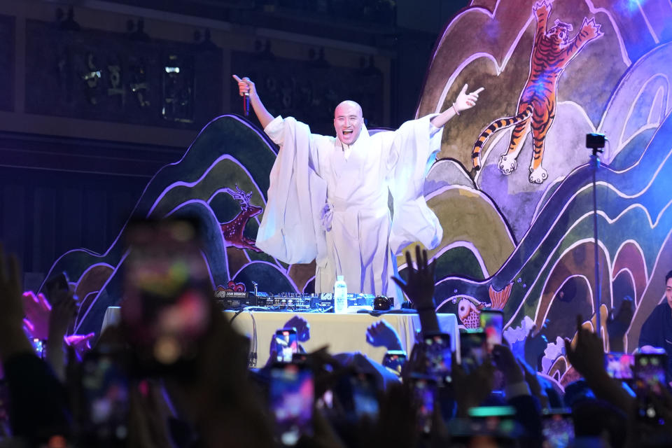 NewJeansNim, a comedian and a DJ, whose real name is Youn Sung Ho, performs at an annual lantern-lighting festival dressed up as a monk, in Seoul, South Korea on May 12, 2024. (AP Photo/Juwon Park)