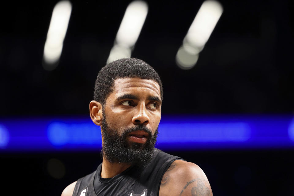 Brooklyn Nets guard Kyrie Irving looks out during the second half of an NBA basketball game against the Indiana Pacers Monday, Oct.  31, 2022, in New York.  (AP Photo/Jessie Alcheh)