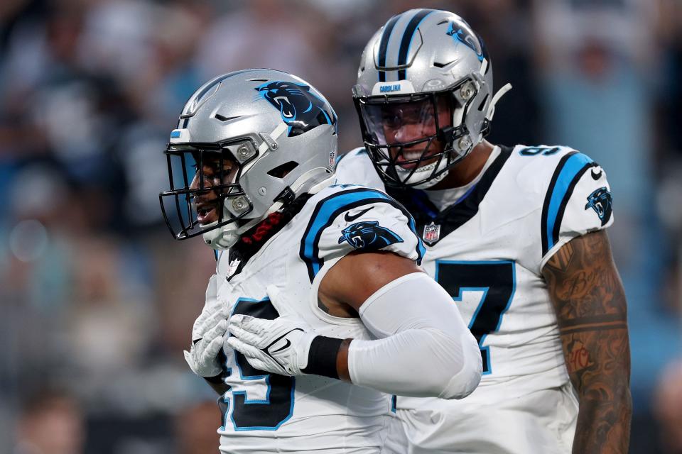 CHARLOTTE, NORTH CAROLINA - SEPTEMBER 18: Frankie Luvu #49 of the Carolina Panthers celebrates after sacking Derek Carr #4 of the New Orleans Saints during the first quarter in the game at Bank of America Stadium on September 18, 2023 in Charlotte, North Carolina. (Photo by Jared C. Tilton/Getty Images)