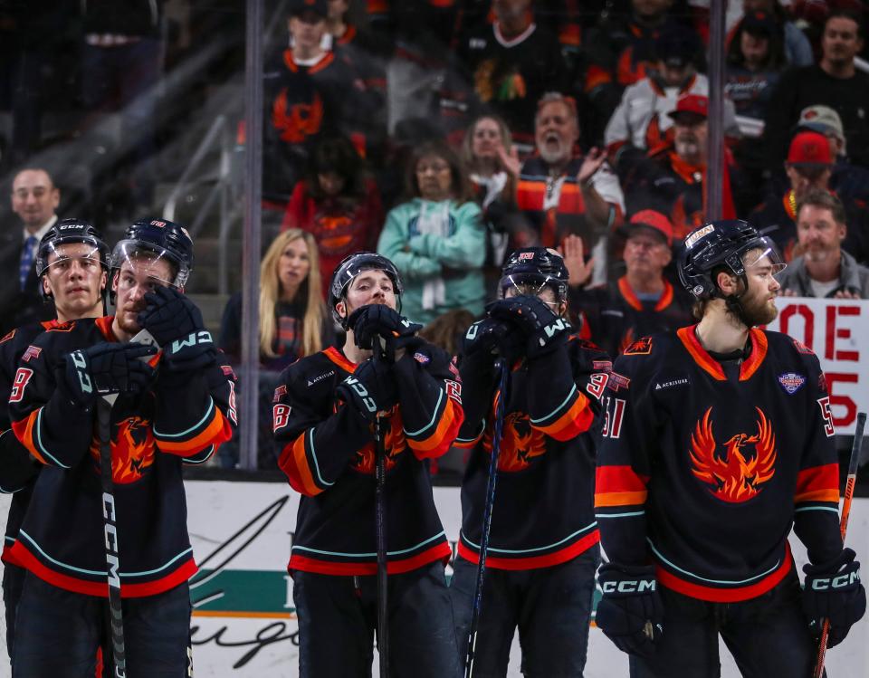 Coachella Valley Firebirds players react to a loss in overtime after Game 7 of the Calder Cup Finals at Acrisure Arena in Palm Desert, Calif., Wednesday, June 21, 2023. 