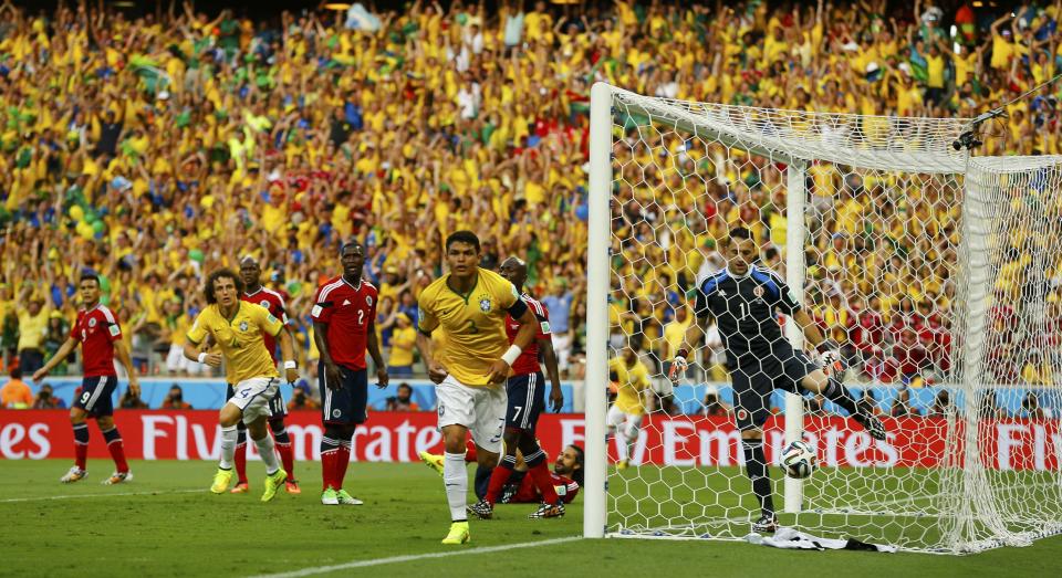 Brazil's Thiago Silva (C) celebrates after scoring against Colombia during their 2014 World Cup quarter-finals at the Castelao arena in Fortaleza July 4, 2014. REUTERS/Marcelo Del Pozo