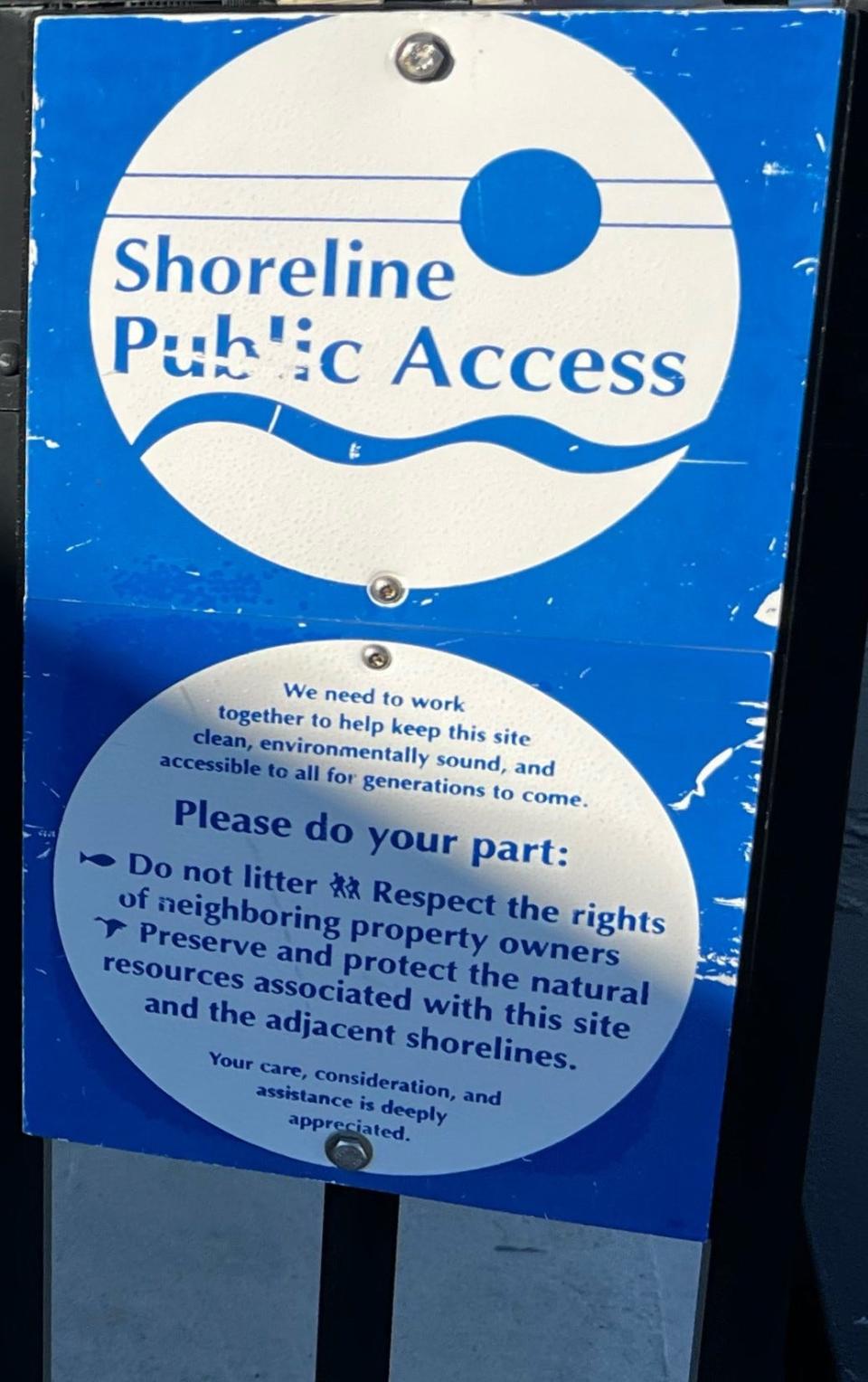 A sign marks a shoreline public access point in Rhode Island.