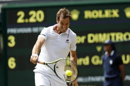 Richard Gasquet of France hits a shot during his match against Grigor Dimitrov of Bulgaria at the Wimbledon Tennis Championships in London, July 3, 2015. REUTERS/Suzanne Plunkett