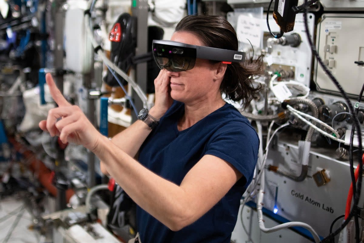 Nasa astronaut Megan McArthur wears a HoloLens VR headset to test an augmented reality application during Expedition 65 (Nasa)