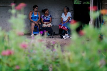 Relatives of Salvadoran migrant Marvin Antonio Gonzalez, who recently died in a border detention center in New Mexico, gather at their home in Verapaz