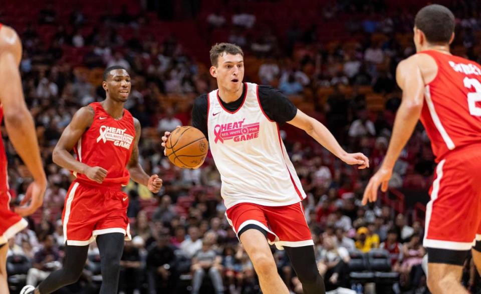 Miami Heat forward Nikola Jovic (5) looks to pass the ball in the second half of the Heat Red, White & Pink intrasquad scrimmage game at the Kaseya Center on Monday, Oct. 9, 2023, in downtown Miami, Fla.