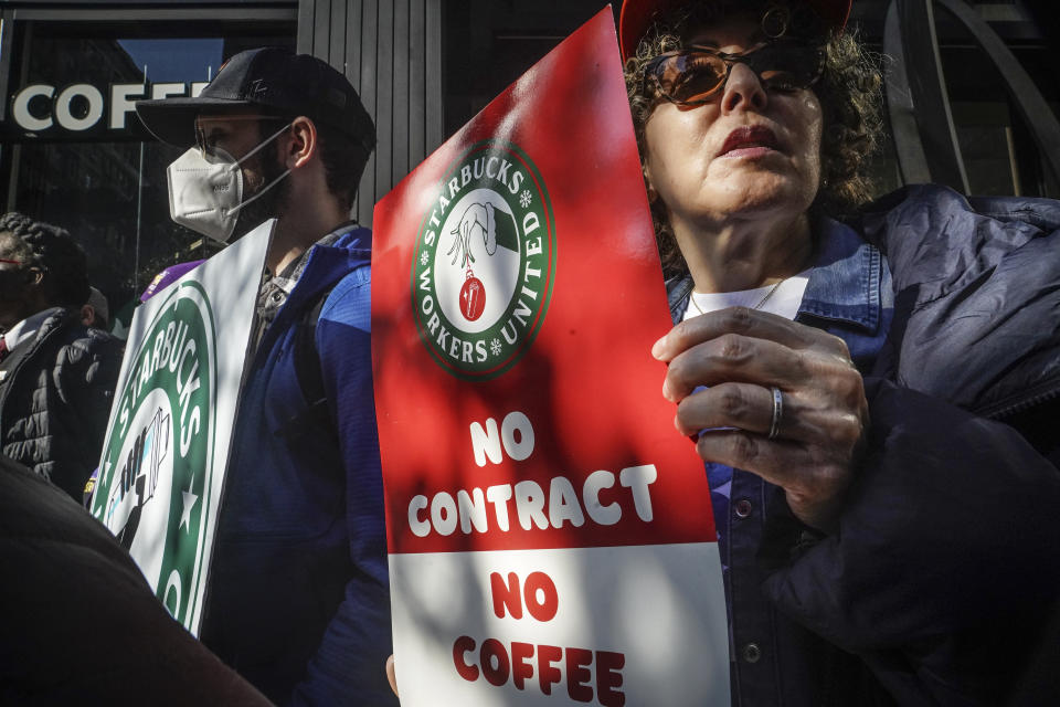 Protestors among a coalition of unions and Starbucks workers rally outside a midtown Manhattan Starbucks coffee store, calling for a "fair schedules and wages," Thursday, Nov. 16, 2023, in New York. (AP Photo/Bebeto Matthews)