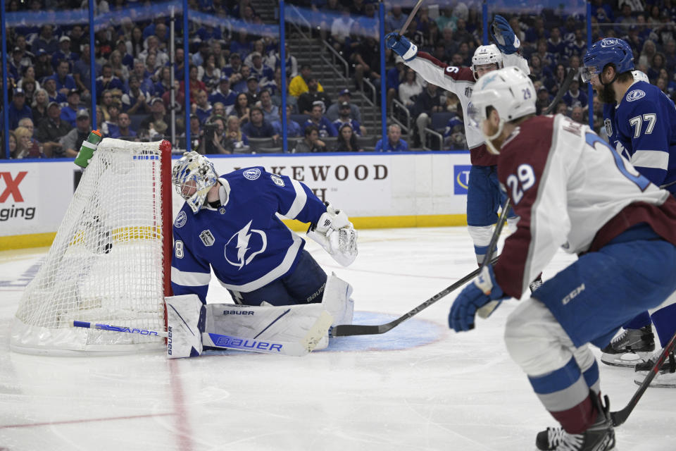 Colorado Avalanche center Nathan MacKinnon (29) shoots the puck past Tampa Bay Lightning goaltender Andrei Vasilevskiy (88) for a goal during the second period of Game 6 of the NHL hockey Stanley Cup Finals on Sunday, June 26, 2022, in Tampa, Fla. (AP Photo/Phelan Ebenhack)