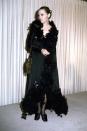 <p>Faye Dunaway brought the drama in a black ruffled wrap dress, and slicked back hair. </p>