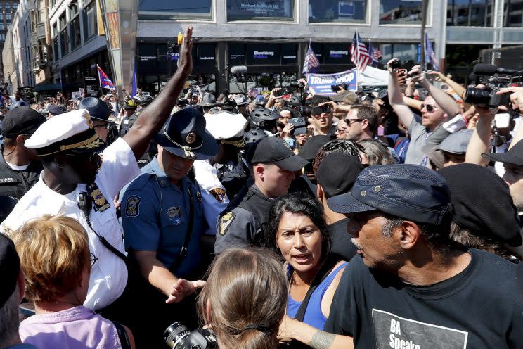 Cleveland Police Chief Calvin Williams, left, talks with protesters on Wednesday. (Photo: Alex Brandon/AP)