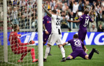 Soccer Football - Serie A - Juventus v Fiorentina - Allianz Stadium, Turin, Italy - April 20, 2019 Fiorentina's Germsan Pezzella scores an own goal and Juventus' second as Juventus' Federico Bernardeschi celebrates REUTERS/Massimo Pinca