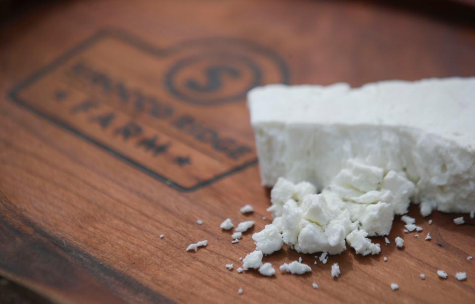 Caprini Legacy feta-style cheese from Sirocco Ridge Farm in Henryville, Ind. The cheese is soft, with a creamy feel and less salty. The cheese can be sliced, crumbled (like on the board) or grilled. March 16, 2023.