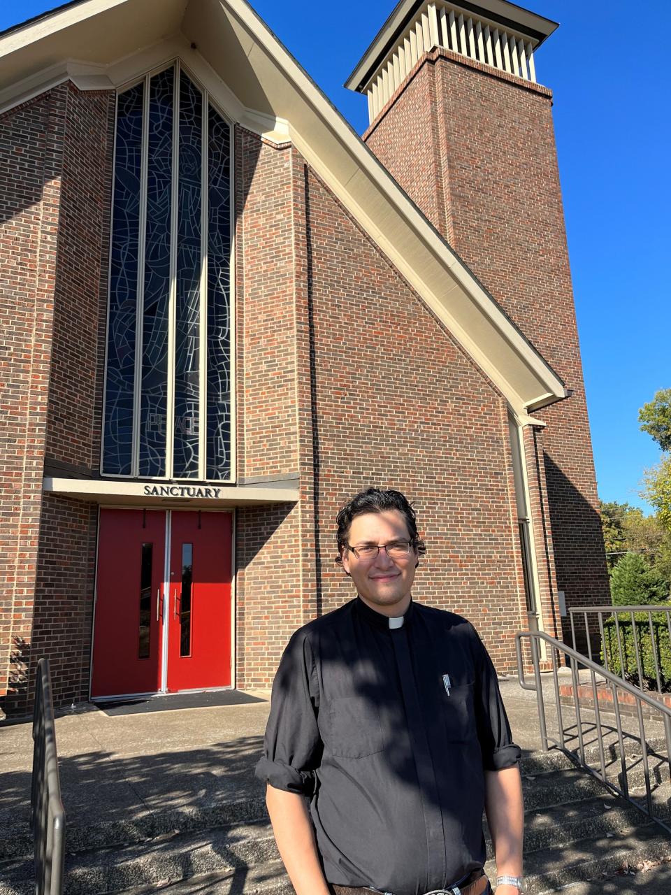 The Rev. Caleb Pitkin, the new pastor at First United Methodist Church on Kingston Pike, stands outside the church on Oct. 3, 2023