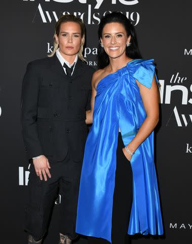 <p>Jon Kopaloff/Getty</p> Ashlyn Harris (left) and Ali Krieger photographed in 2019