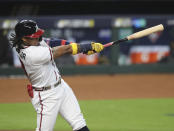 Atlanta Braves' Ronald Acuna hits a solo homer off Miami Marlins starting pitcher Sandy Alcantara during the first inning of Game 1 of a baseball NL Division Series on Tuesday, Oct. 6, 2020, in Houston. (Curtis Compton/Atlanta Journal-Constitution via AP)