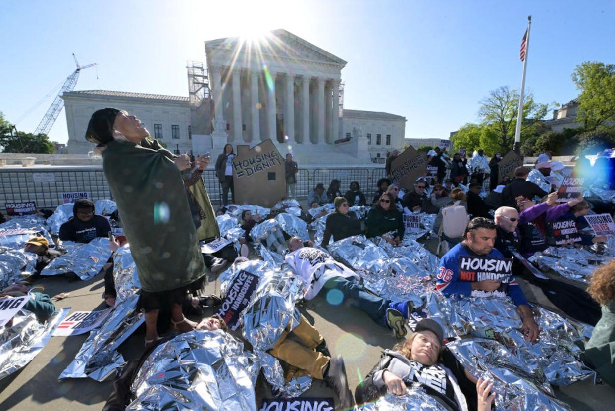 Activists protest outside the Supreme Court before arguments in Grants Pass v. Johnson on April 22, 2024, in Washington, D.C. <a href="https://www.gettyimages.com/detail/news-photo/people-gather-to-protest-outside-the-supreme-court-of-the-news-photo/2149236711?searchscope=image%2Cfilm&adppopup=true" rel="nofollow noopener" target="_blank" data-ylk="slk:Matt McClain/The Washington Post via Getty Images;elm:context_link;itc:0;sec:content-canvas" class="link ">Matt McClain/The Washington Post via Getty Images</a>