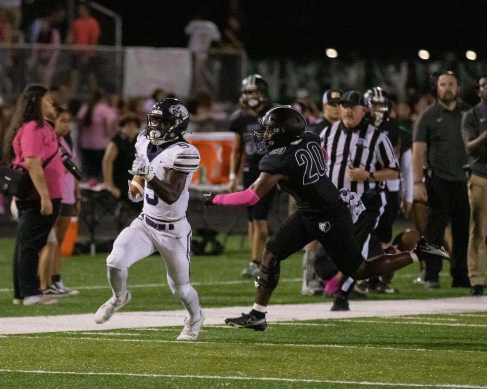 Naples running back Shawn Simeon (5) runs the ball during a game at Palmetto Ridge High School in Naples on Friday, Oct. 6, 2023.