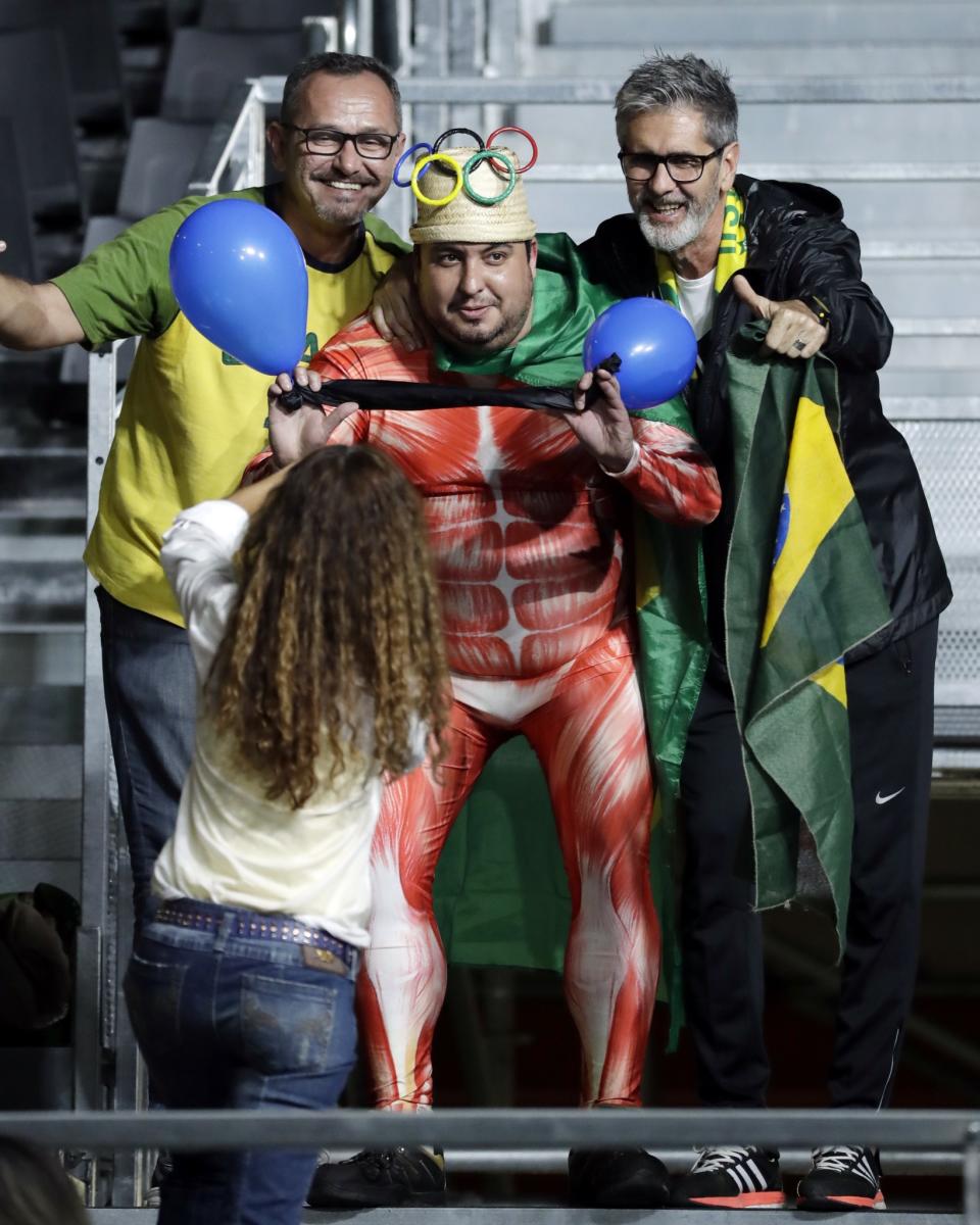 <p>Fans pose for a photo before the start of the men’s 56kg weightlifting competition at the 2016 Summer Olympics in Rio de Janeiro, Brazil, Sunday, Aug. 7, 2016. (AP Photo/Mike Groll) </p>
