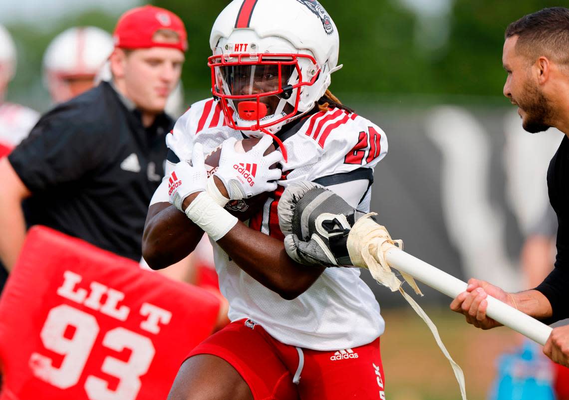 N.C. State running back Kendrick Raphael (20) runs a drill during the Wolfpack’s first fall practice in Raleigh, N.C., Wednesday, August 2, 2023. Ethan Hyman/ehyman@newsobserver.com