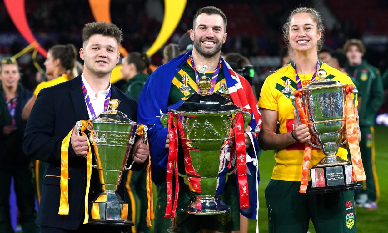 <span>Australia’s James Tedesco (centre) with the men’s trophy, Australia’s Kezie Apps (right) with the women’s trophy and England’s Tom Halliwell with the wheelchair trophy in 2022.</span><span>Photograph: Tim Goode/PA</span>