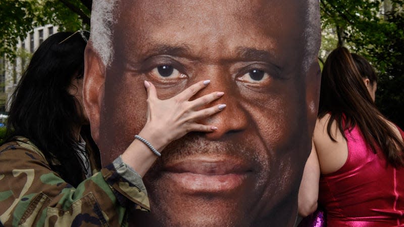 Demonstrators with a sign of U.S. Supreme Court Justice Clarence Thomas during an abortion-rights protest in New York, U.S., on Tuesday, May 3, 2022. 