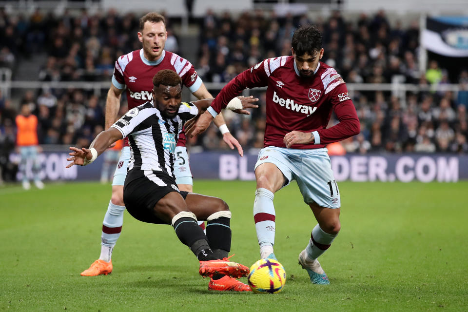 NEWCASTLE UPON TYNE, ENGLAND - FEBRUARY 04: Allan Saint-Maximin of Newcastle United tackles Lucas Paqueta of West Ham United during the Premier League match between Newcastle United and West Ham United at St. James Park on February 04, 2023 in Newcastle upon Tyne, England. (Photo by George Wood/Getty Images)