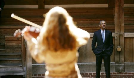 U.S. President Barack Obama watches a selection of songs and excerpts from Hamlet as he tours the Globe Theatre in London to mark the 400th anniversary of William Shakespeare's death April 23, 2016.REUTERS/Kevin Lamarque