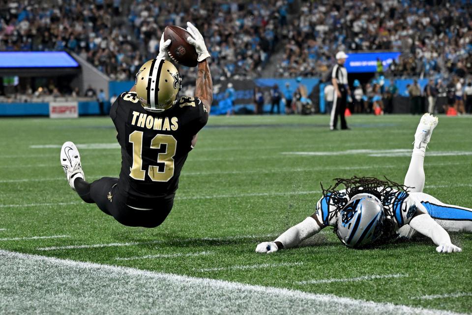 CHARLOTTE, NORTH CAROLINA - SEPTEMBER 18: Michael Thomas #13 of the New Orleans Saints catches a pass against Donte Jackson #26 of the Carolina Panthers during the second quarter in the game at Bank of America Stadium on September 18, 2023 in Charlotte, North Carolina. (Photo by Grant Halverson/Getty Images)