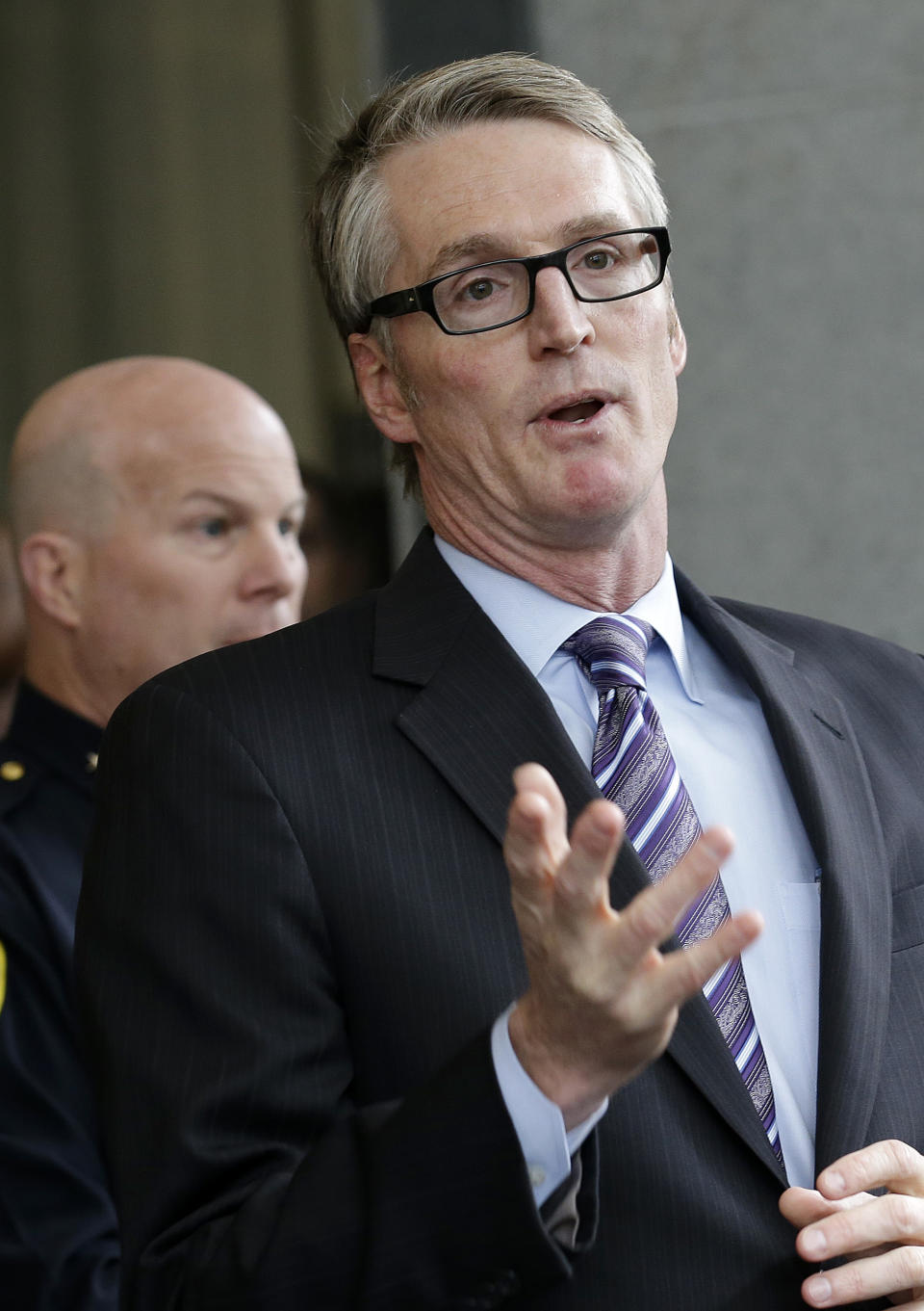 Special FBI Agent-in-Charge David Johnson, right, speaks next to San Francisco Police Chief Greg Suhr at a news conference in San Francisco, Monday, Jan. 6, 2014. The FBI says a Chinese national has been arrested in the investigation of a fire set intentionally at the Chinese Consulate in San Francisco. Johnson said Monday that 39-year-old Yan Feng, of Daly City, was arrested Friday after he called police in the San Francisco suburb. (AP Photo/Jeff Chiu)