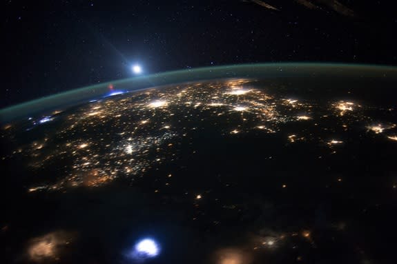 Astronauts aboard the International Space Station captured this rare of a red sprite above a thunderstorm (glowing white) on Aug. 10, 2015, somewhere over Missouri or Illinois.