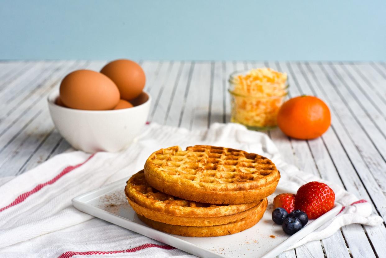 Egg and cheese waffles (Chaffles) on a wooden table